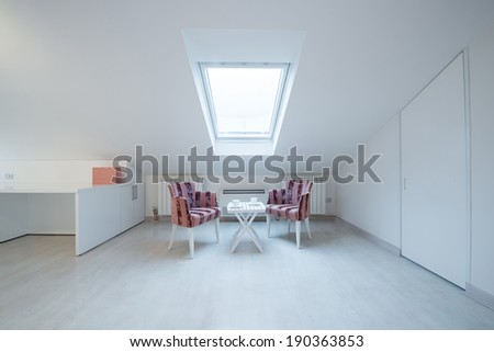 Interior of a bright white cozy loft in luxury apartment