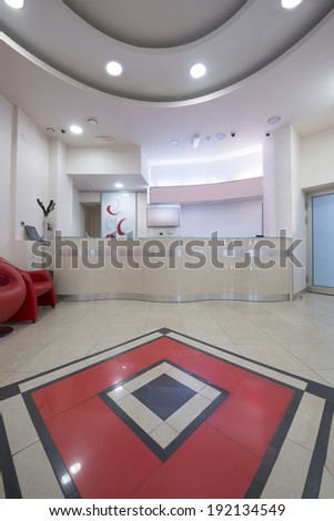 Interior of a modern waiting room with reception desk - reception area