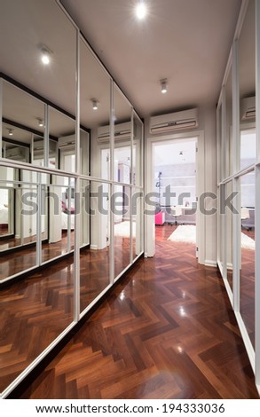 Modern corridor interior with mirror wardrobe doors