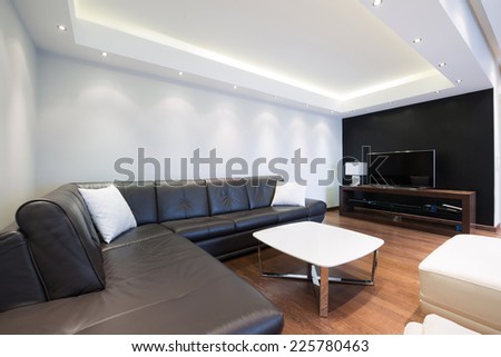 Interior of a spacious luxury living room with ceiling lights