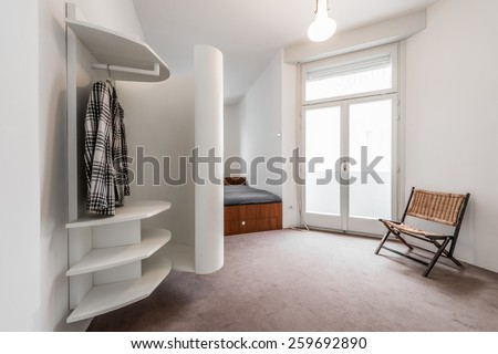 Apartment interior with modern white closet