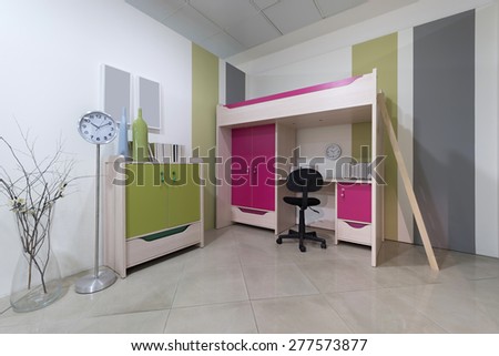 Interior of student (teenager) room with bed over working table - back to school