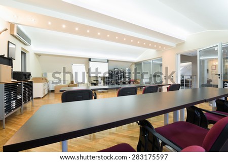 Meeting room with projector in modern office interior