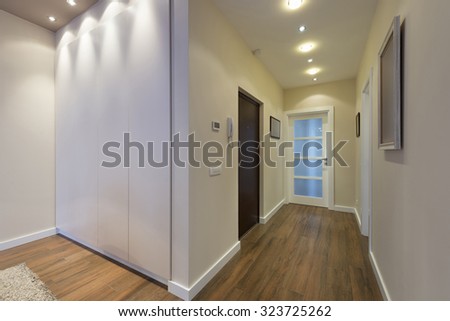 Apartment corridor with brown floor