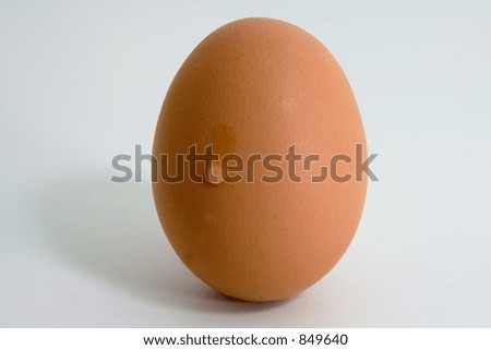 A single tear flowing down a brown egg A single tear flowing down a brown egg