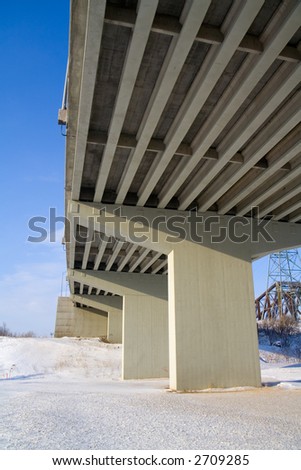 Underside of a concrete ramp leading to the Pierre Laporte Bridge