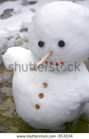 Snowman with a big nose and a big grin.