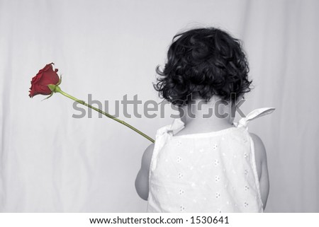 Little Girl holding a rose - rose is normal color, rest made black and white.