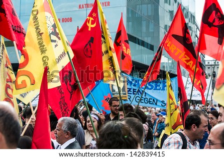 STUTTGART, GERMANY - June 15, 2013: People protest against the Stuttgart21 railway project and unite with people demonstrating against the happenings in Turkey on June 15, 2013 in Stuttgart, Germany.