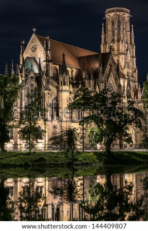 Beautiful Johanneskirche protestant church over Feuersee (Fire lake) in Stuttgart, Germany at night