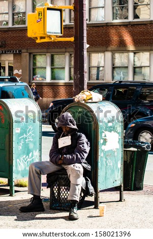 NEW YORK, USA - SEPTEMBER 28, 2013: A jobless man begging for a job as a painter on September 28, 2013 in Manhattan, New York City, USA.