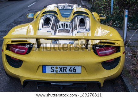 STUTTGART, GERMANY - JANUARY 1, 2014: Porsche 918 Spyder prototype (hybrid using a V8 plus two electronic motors) is parked in the streets of its hometown on January 1, 2014 in Stuttgart, Germany.