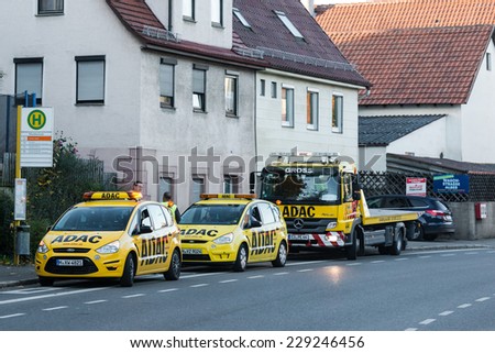 BERNHAUSEN, GERMANY - NOVEMBER 08,2014: Two maintenance cars and a tow truck of ADAC (The German Automobile Association) are about to leave for their next client after fixing a broken car on November