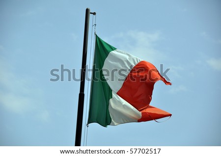 Large Italian flag floating in the wind