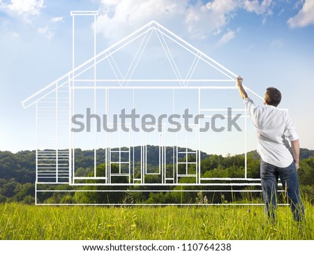 Man drawing a house blueprint in nature
