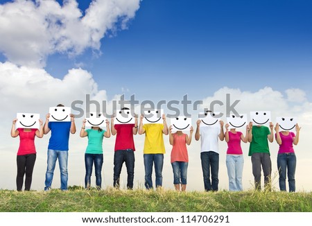 Group Of Young People Holding Papers With Smileys In Front Of Their Faces