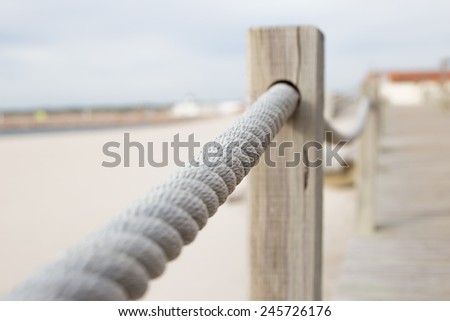 Rope barrier on beach with selective focus