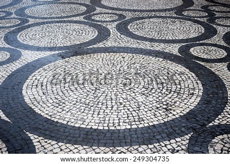 Circles on traditional portuguese street stone pavement