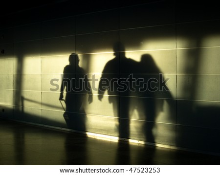Shadows of traveling people in the morning