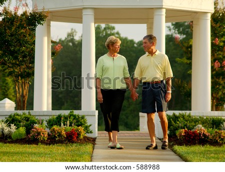 Senior couple walking in active adult community