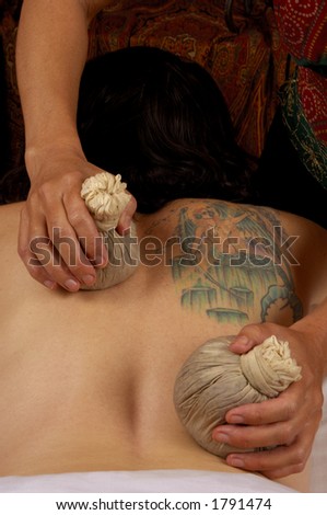 Massaging Back with Thai Compresses at Mind and Body Boutique
