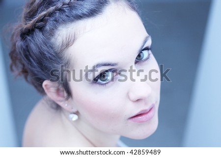 Young women looking into the camera with a model like look