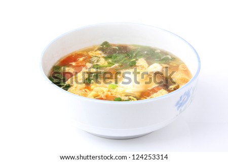 bowl with delicious egg soup . Chinese cuisine