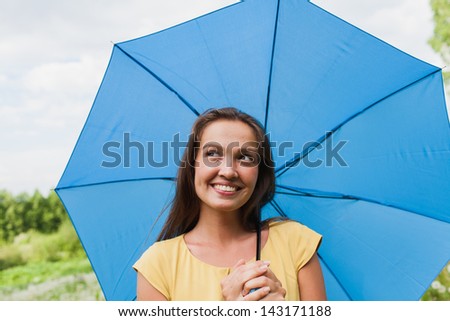 young girl with blue umbrella