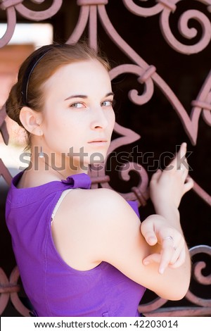 had left the girl in a lilac dress standing at the wrought-iron fence