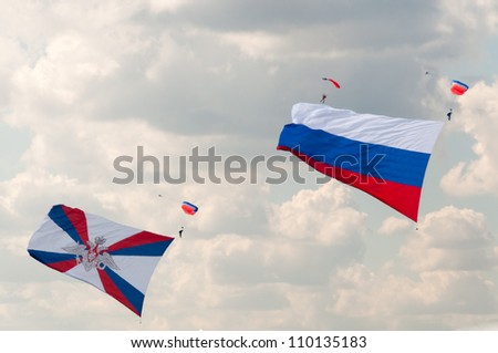 ZHUKOVSKY, MOSCOW REGION/RUSSIA - AUGUST 10: Parachute with giant flags of Russia and Ministry of Defense in airshow devoted to 100th anniversary of Russian Air Forces on August 10, 2012 in Zhukovsky.