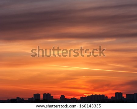 Beautiful bright sunset with cloudscape and multicolored evening glowing over skyline. Moscow, Russia.