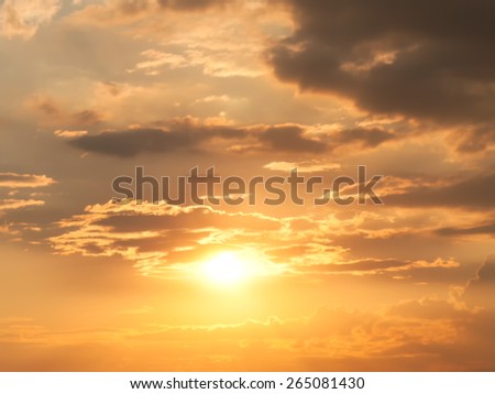 Dramatic sunset with bright Sun behind cloudscape