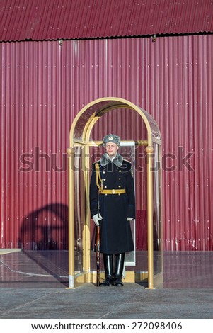 MOSCOW/RUSSIA - APRIL 10: Military student stands in sentry box in guard in honor of grave of the Unknown Soldier and The Eternal Flame on April 10, 2015 in Moscow.