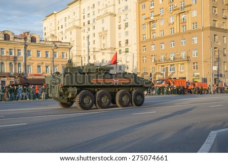 MOSCOW/RUSSIA - MAY 4: Bumerang (Boomerang) amphibious armored personnel carrier (APC) and people on Tversakaja Street on rehearsal devoted to 70-th Victory Day aniversary on May 4, 2015 in Moscow.