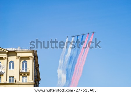 MOSCOW/RUSSIA - MAY 7: 6 Su-25BM Frogfoot jet aircrafts with color smokes of tricolor on rehearsal of parade devoted to 70-th Victory Day anniversary on May 7, 2015 in Moscow.