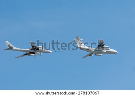 MOSCOW/RUSSIA - MAY 7: Il-78 (Midas) aerial tanker and Tu-95MS (Bear) large strategic bombers and missile platform demonstrate refueling on parade devoted to Victory Day on May 7, 2015 in Moscow.