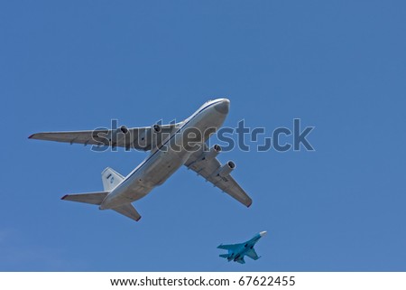 MOSCOW - MAY 9: An-124 Ruslan cargo strategic airlift jet and Su-27 jet fighter on the winning parade show devoted to 65th anniversary of victory in the Great Patriotic war on May 9, 2010 in Moscow.