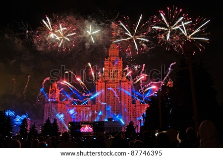 Beautiful fireworks on Lomonosov Moscow State University Main Building background at night.