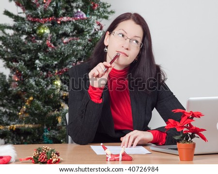 business woman making a christmas present wish list