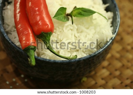 Thai Asian cuisine: Asian diet comprising of red chillies and fluffy jasmine rice  in a basket tray