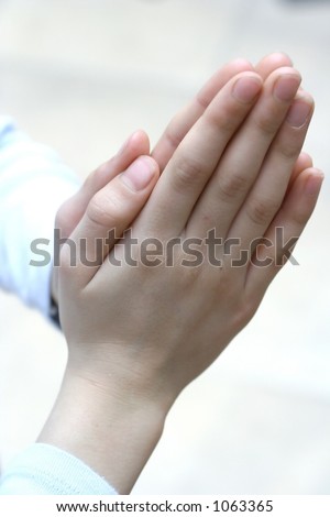 Conceptual image - Two hands clasp together showing appreciation and thankfulness