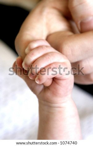 I\'ll be there for you : Tiny baby\'s fingers grasping tight onto the mother\'s index finger