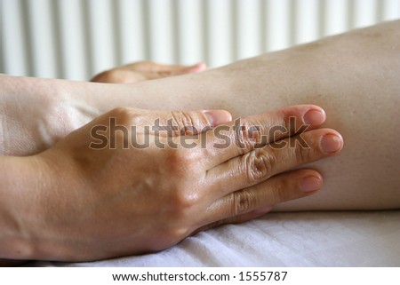 A woman receiving a holistic massage treatment
