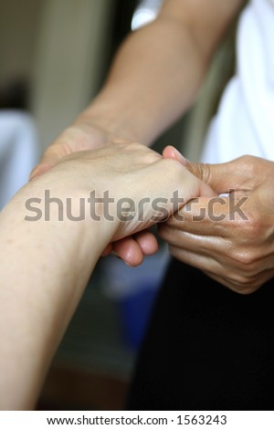 A hand massage as part of a holistic massage treatment