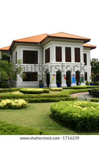 An old \'istana\' ( home for the old king ) in a tropical island with a well manicured front garden