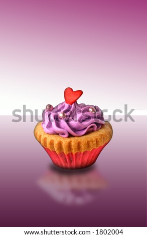 A single mini cupcake with butter frosting and a heartshaped decoration, with reflection