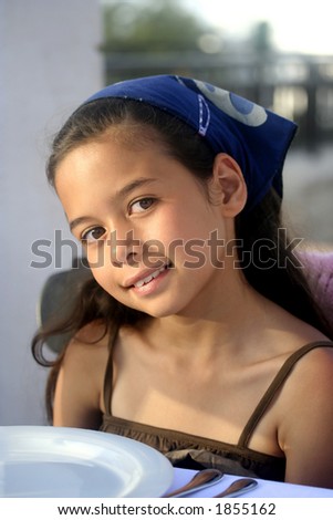 A young girl basking in the warm glow of the evening sun