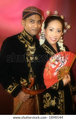 stock photo A Malay bride and groom in their traditional Javanese costume 