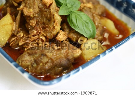 Close up of traditional lamb curry, famous South Indian food made up of lamb chunks, coconut milk and lots of fresh spices