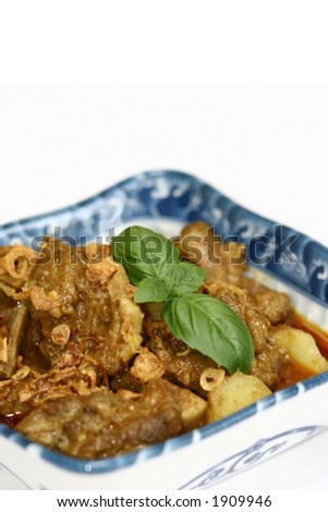 Close up of lamb curry, traditional dish of South India made up of lamb chunks, curry powder, coconut milk and fresh spices